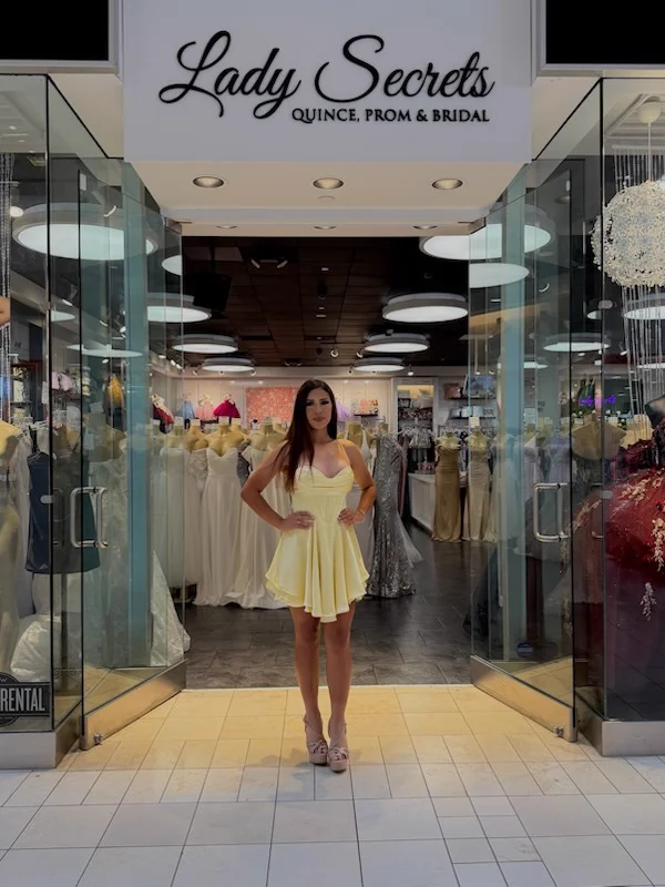 Yellow occasion dress at the entrance to Lady Secrets